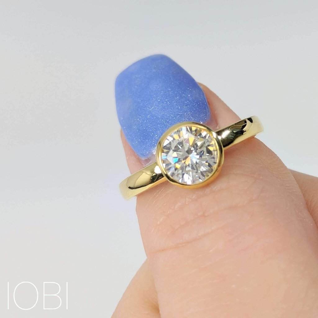 Coco D'ora 1.25CT Round Bezel Set OB Simulated Diamond Solitaire 18K Gold over Sterling Silver Ring for Women Bridal Engagement Wedding Anniversary Gift