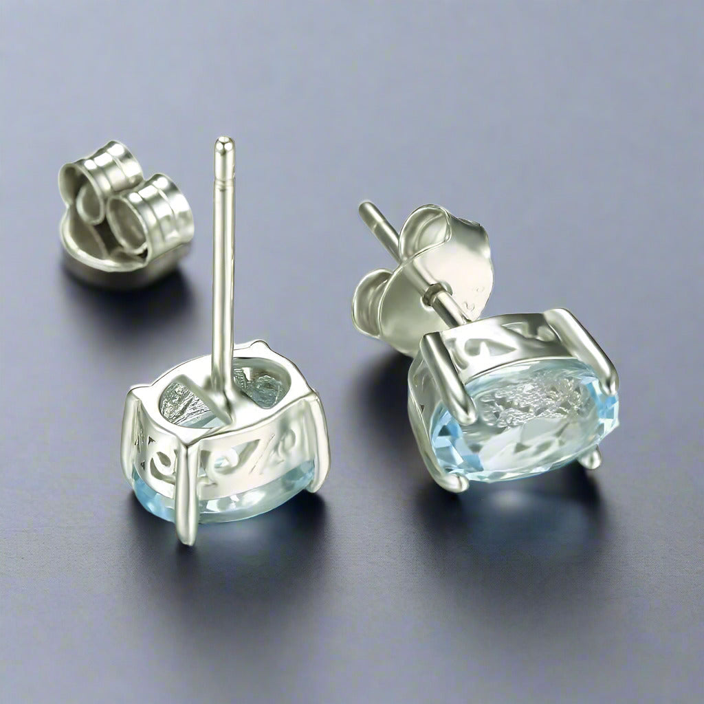 Feshionn IOBI Earrings Ice Blue Genuine Topaz Oval Cut 1.8 CT IOBI Precious Gems Stud Earrings
