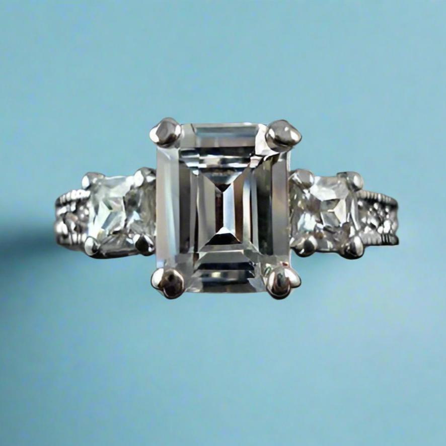 Feshionn IOBI Rings Timeless Three Stone Emerald Cut Swiss CZ Diamond Engagement Ring with Princess Accents - Ring